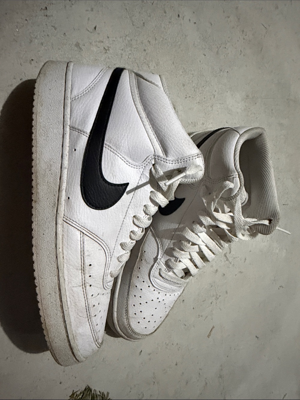 Nike White High-Top Sneakers with Black Swoosh